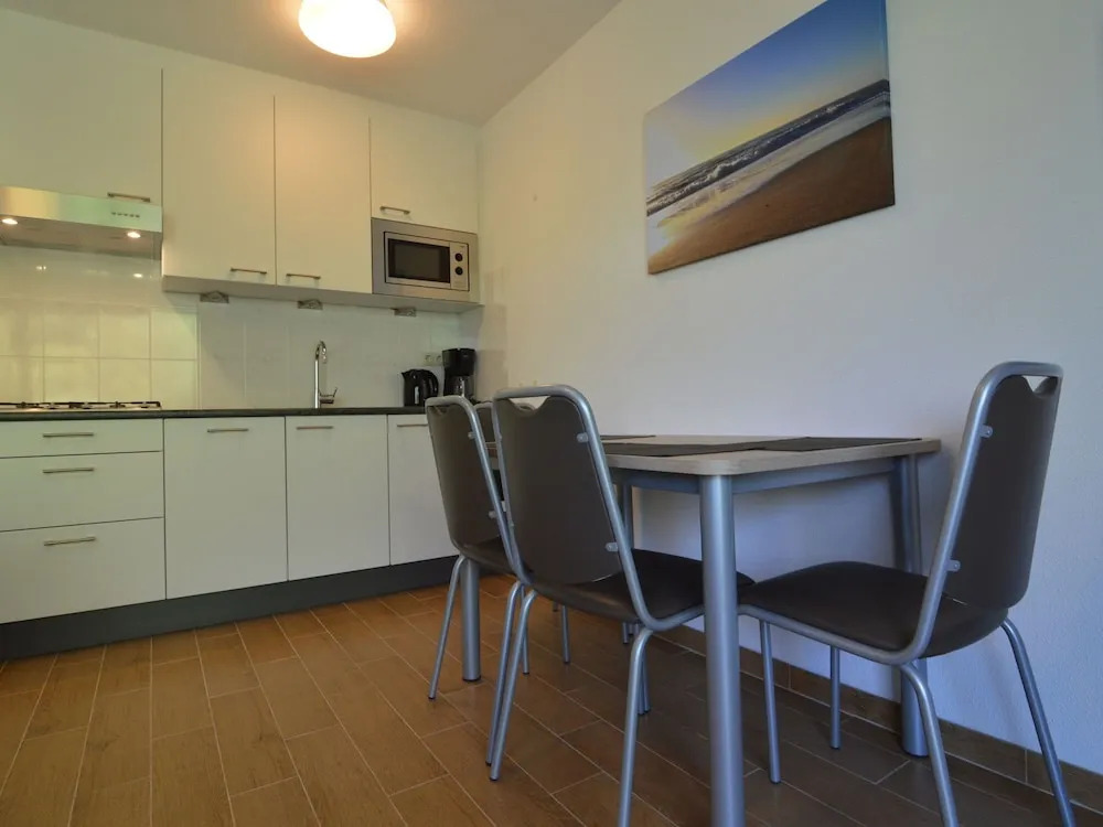 Apartment in Nieuwvliet with Roof Terrace, Garden, Parking