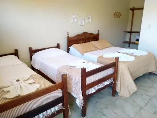 Pousada Luz do Sol, com piscina, quartos amplos e confortáveis no centro de Carrancas