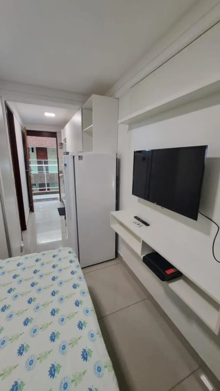 Confortável Flat com piscina de borda infinita na cobertura