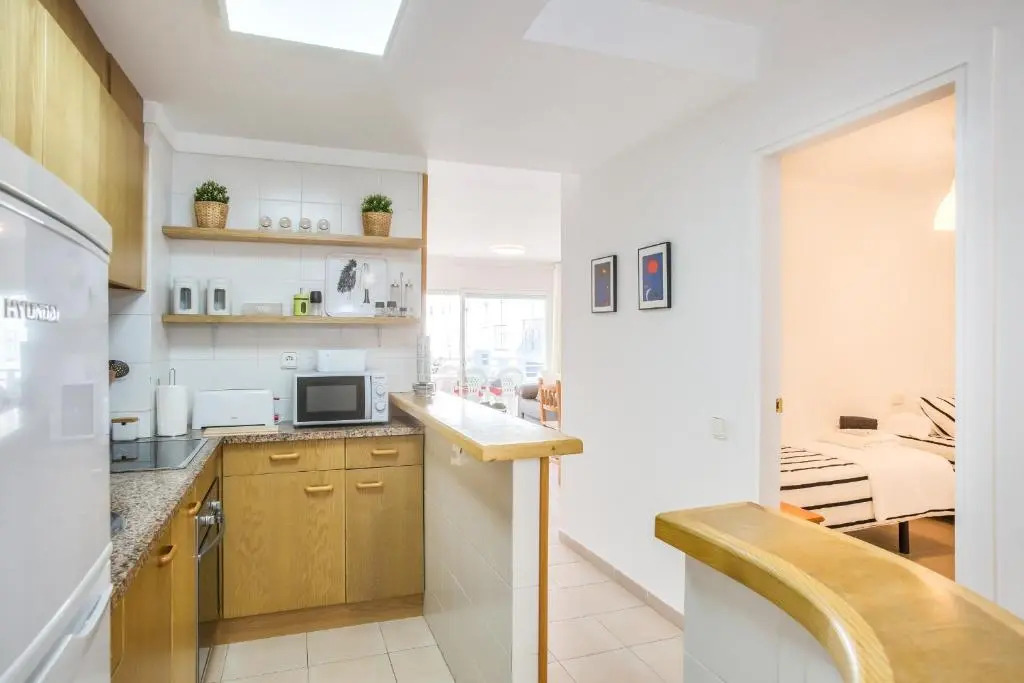 Lets Holidays White Apartment with Terrace, AC & Parking, Near Beach