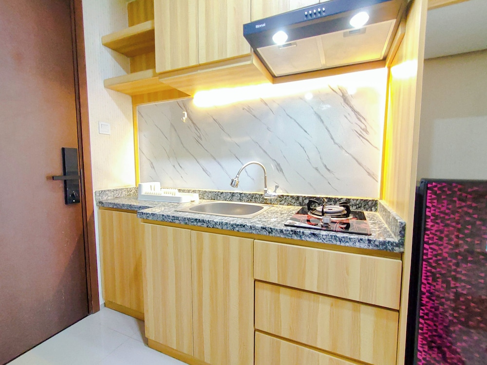 Wood Accents Studio At Grand Dharmahusada Lagoon Apartment