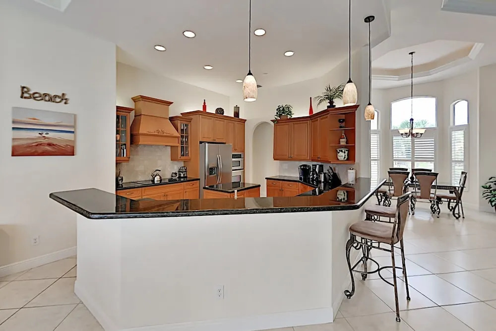 Upscale All-suite Canal W/ Dock & Fireplace 4 Bedroom Home