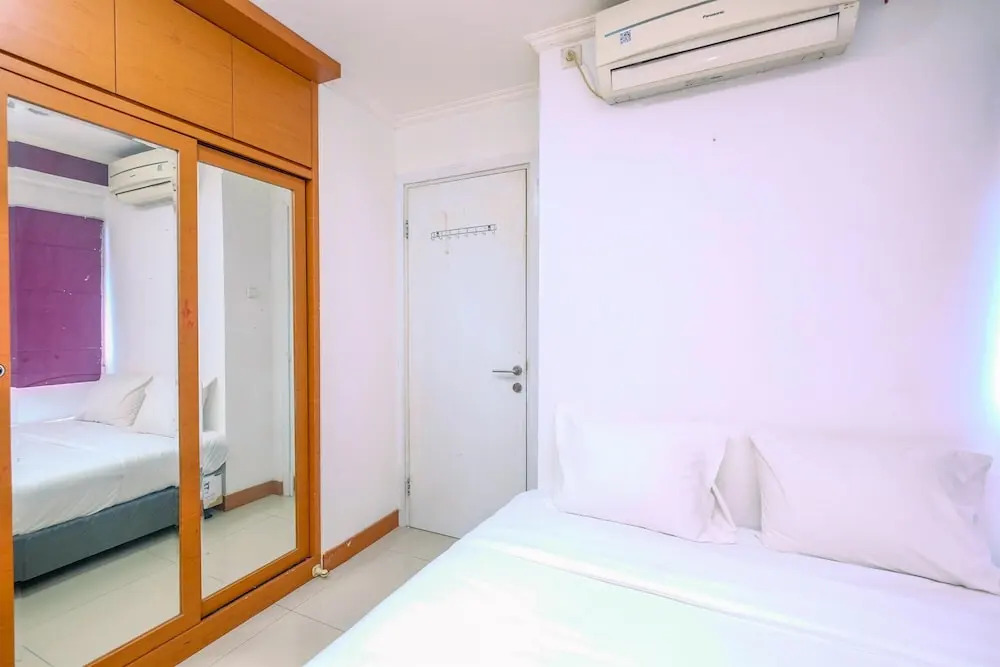 Comfy and Great Choice 2BR Green Pramuka City Apartment By Travelio