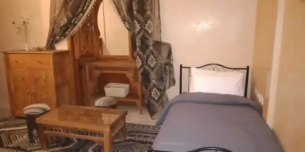 "room in Guest Room - Riad Lakouas Triple Room With Pool View"