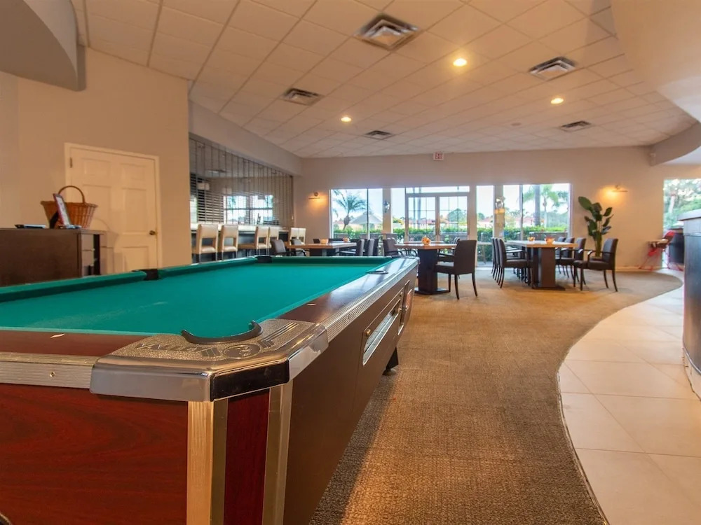 Private Screened Splash Pool Overlooking Tranquil Lake Right Beside Disney World by Florida Dream Homes