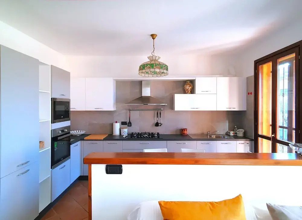House in Luino with Green Garden and City Views