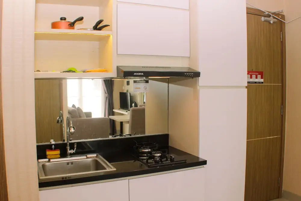 Cozy and Comfort Living 1BR at Oasis Cikarang Apartment By Travelio