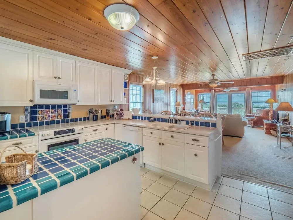 A Charm of Finches by Topsail Realty