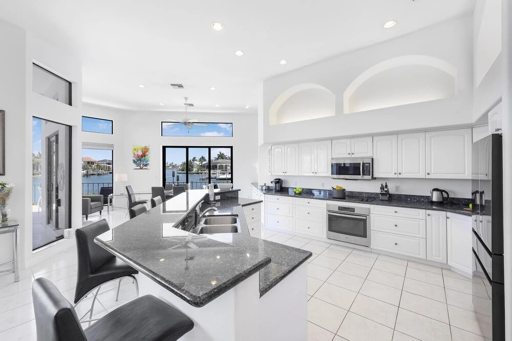 Waterfront home on key lot with pool, spa and views