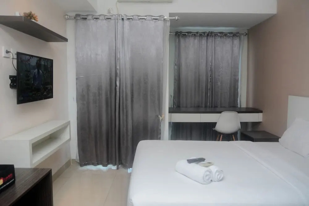 Minimalist and Comfy Studio at Grand Dhika City Apartment By Travelio