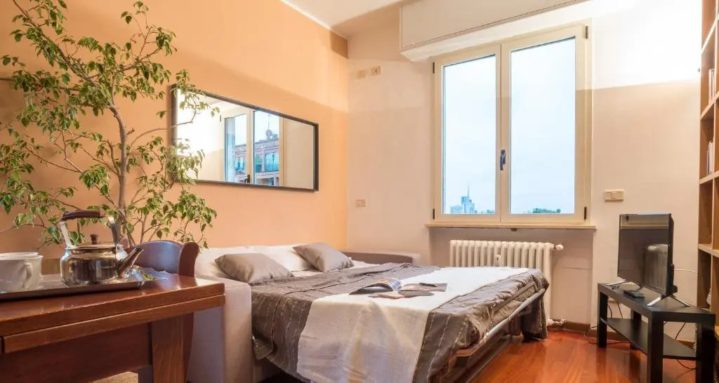 ALTIDO Warm Family Flat for 6 with Terrace in Milan