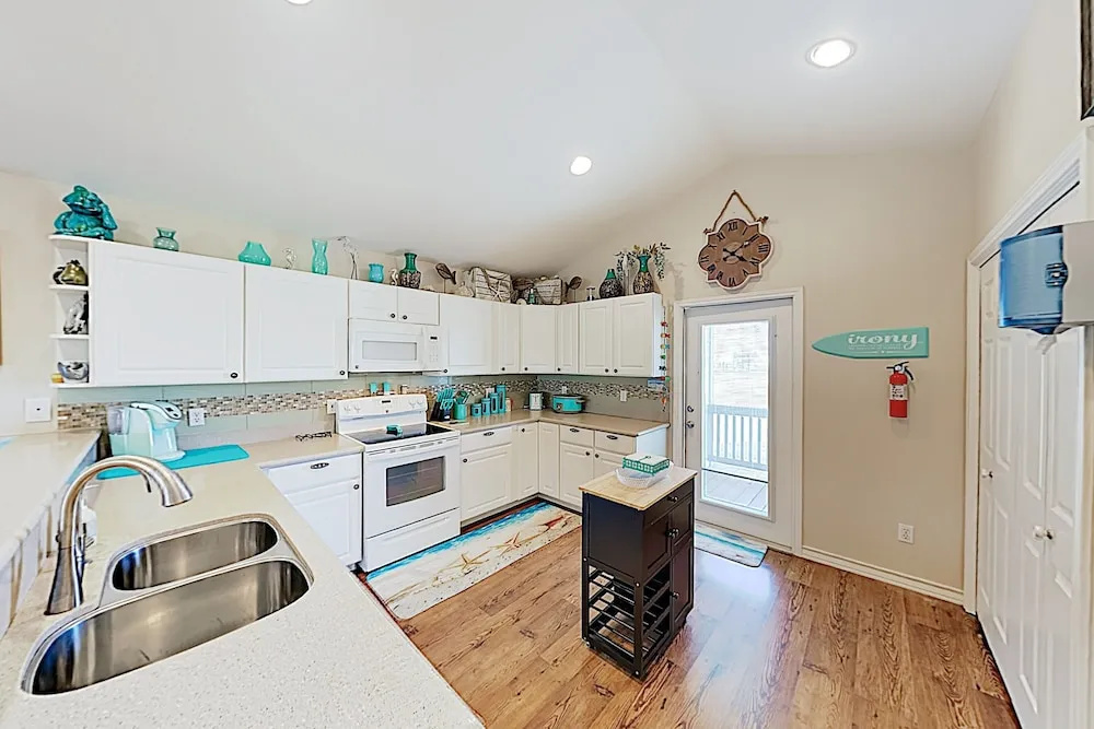 Canal-front Getaway W/ Enclosed Deck & Boat Dock 4 Bedroom Home