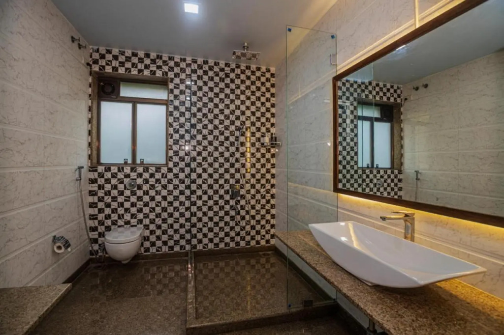 SaffronStays Aura - 4BR luxury pool villa with gym, BBQ deck, lawns & indoor games near Kihim Beach