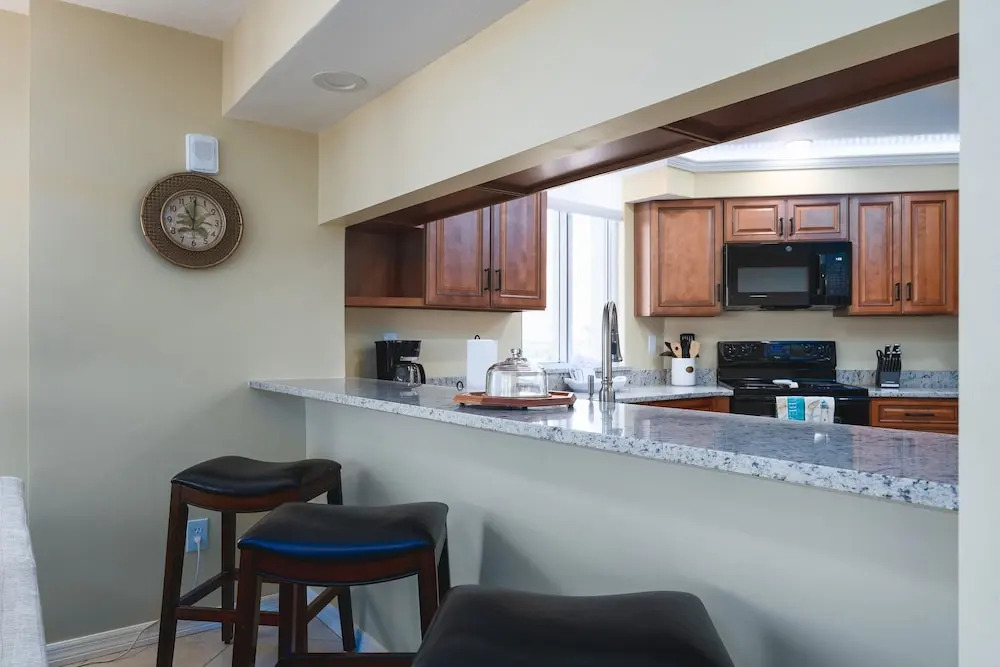 Immaculate Gated Community Condo - Just Across The Street From The Beach! 2 Bedroom Condo by RedAwning