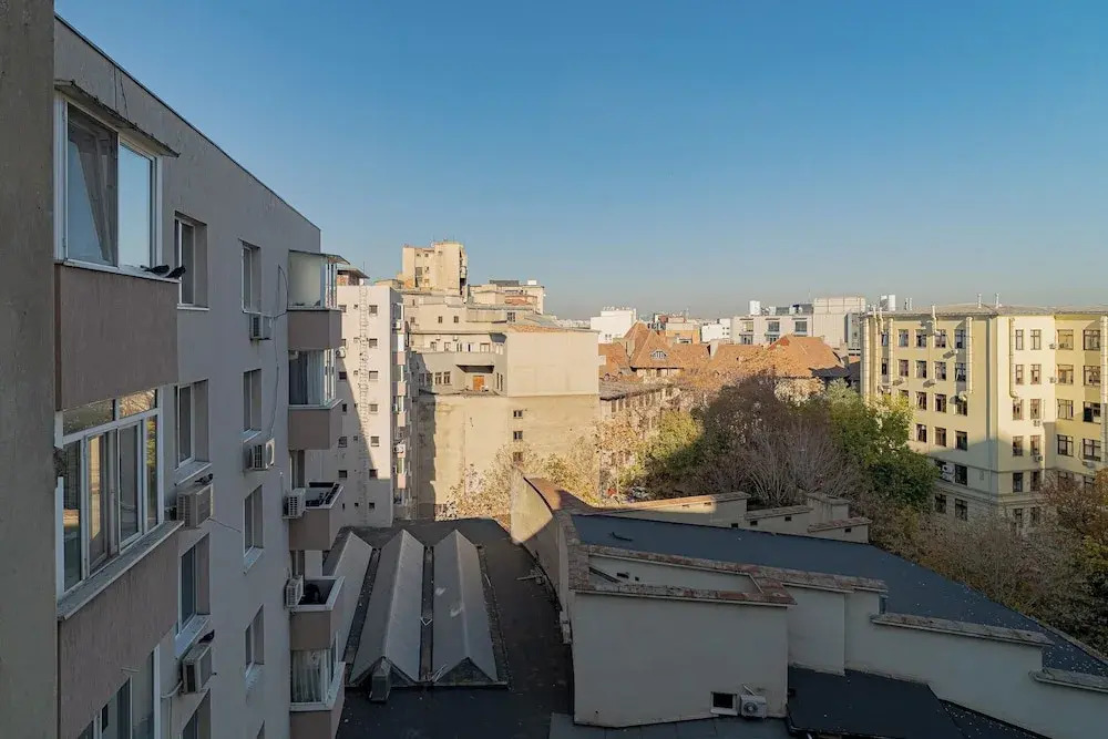 Top-Floor Romanian Athenae 2BR Apartment, Quiet City Views