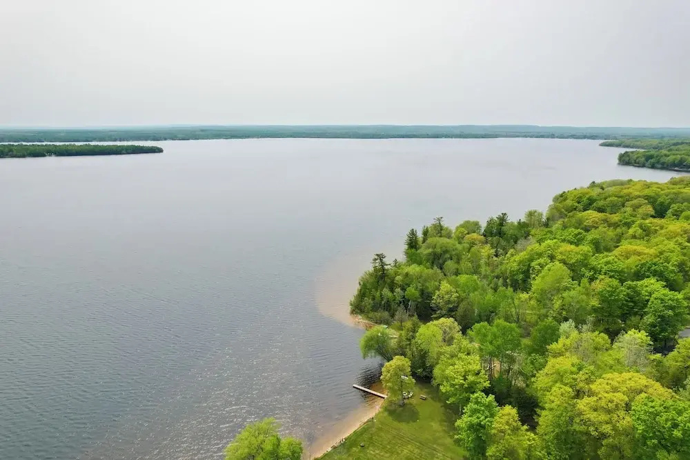 Cozy Carp Lake Cottage w/ Dock, Kayaks & Fire Pit