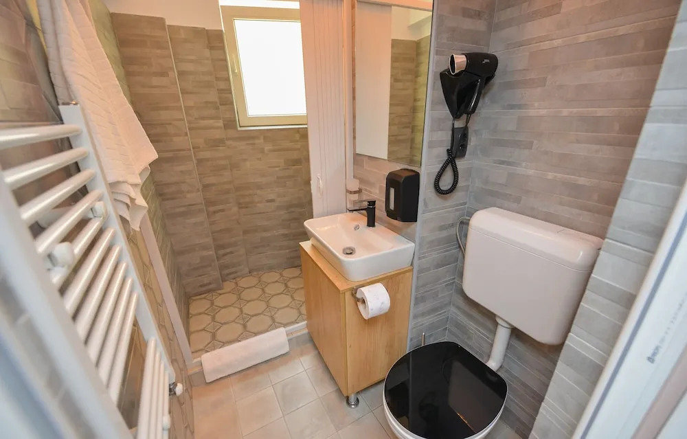One by One by Grand Accommodation