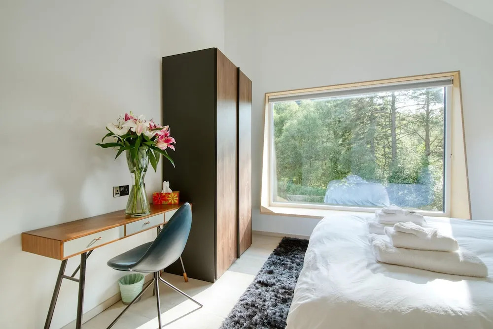 An Caisteal Lodge with cascading waterfall view