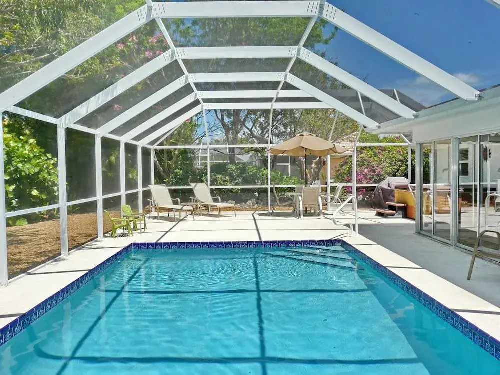 Cozy Home With Sunroom, Pool and Steps to Beach