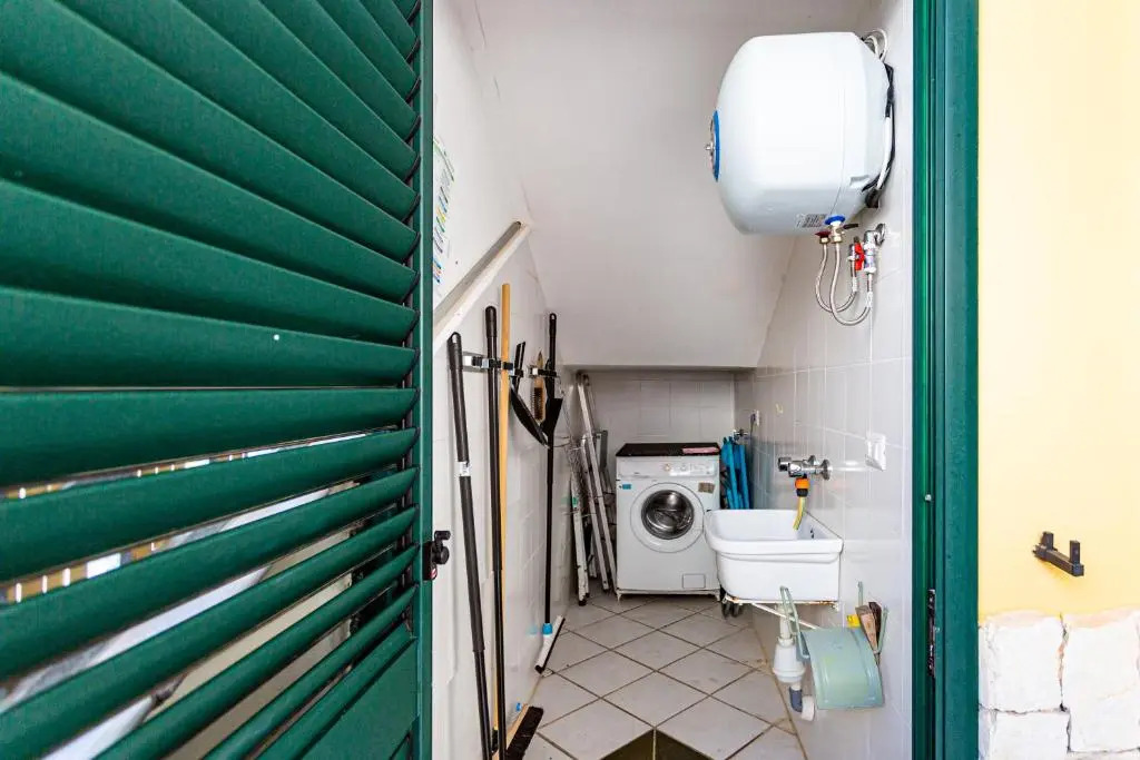 Appartamento climatizzato con patio esterno privato a 150m dal mare