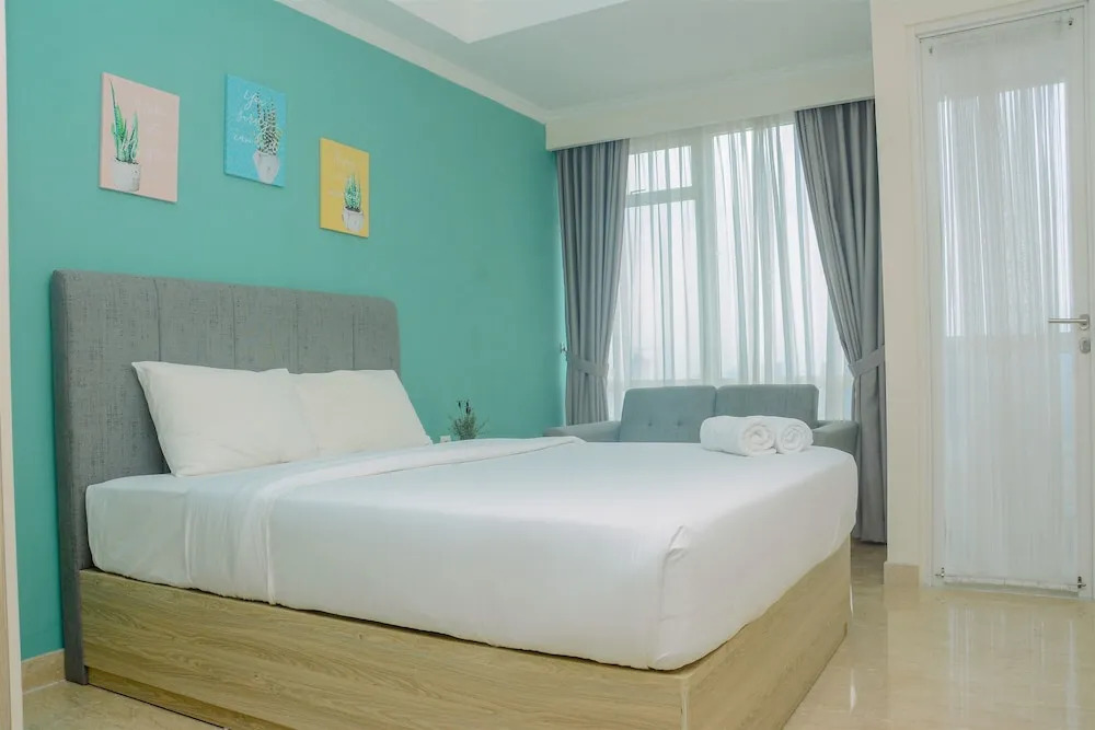 Fully Furnished and Comfortable Design Studio Menteng Park Apartment By Travelio