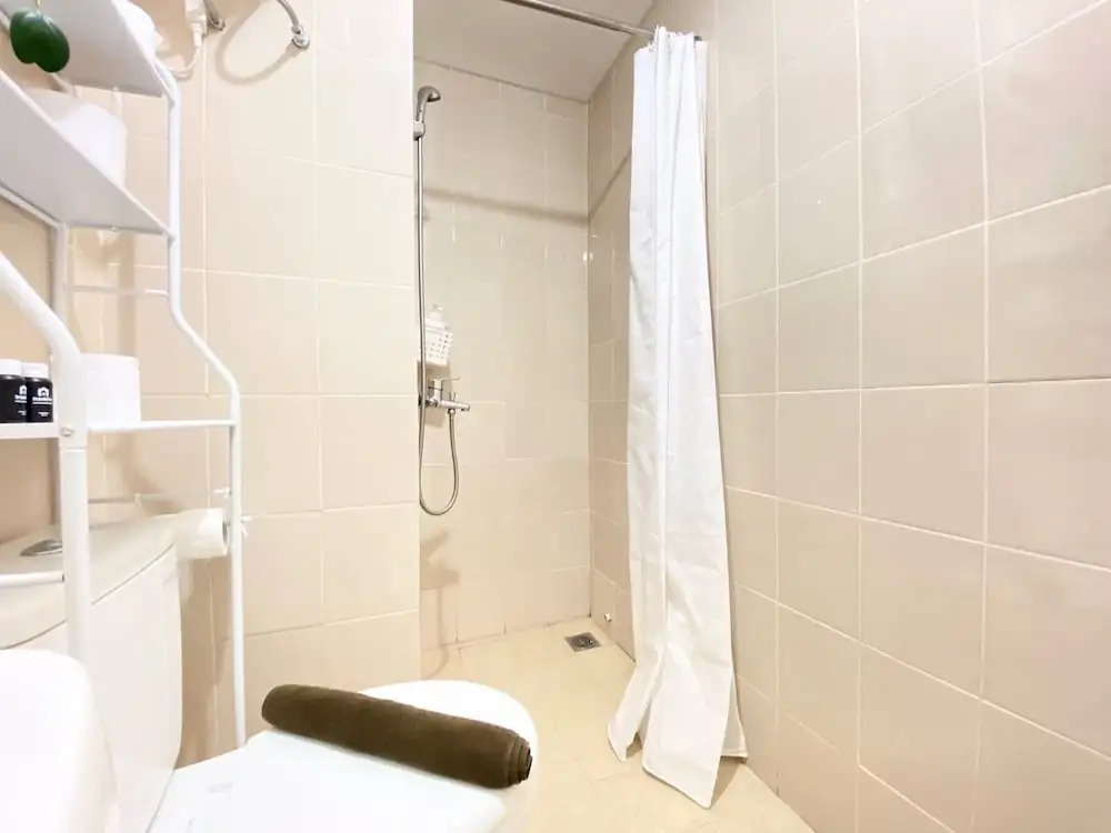 Bright and Private 2BR Apartment at Parahyangan Residence near Nara Park By Travelio