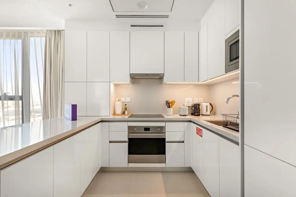 Bright 1BR Escape w Balcony Building Pool