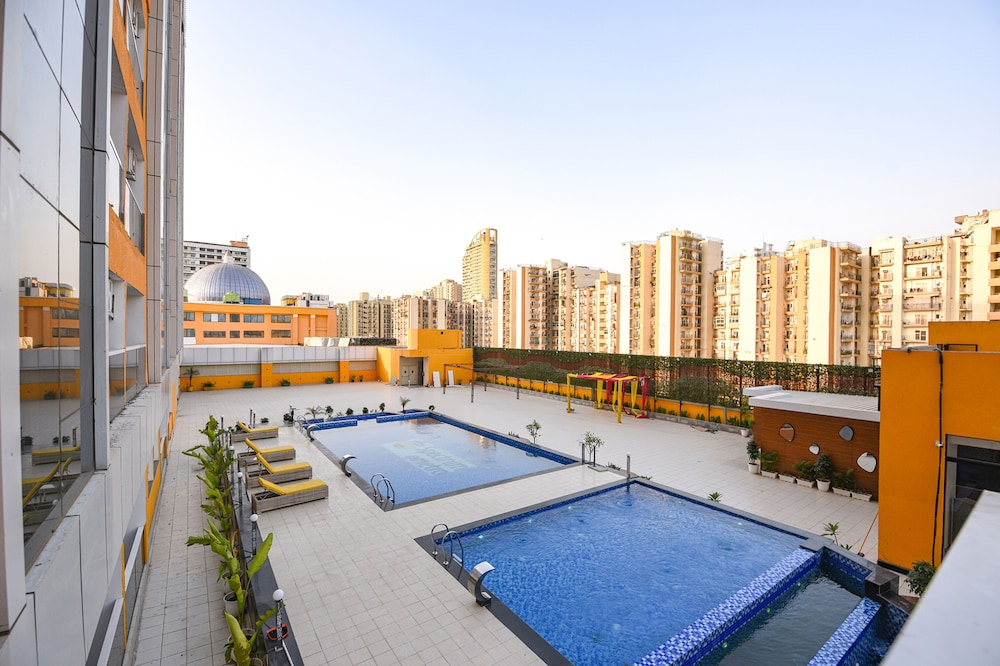 FabHotel Prime Spectrum Metro - With Pool | 5 mins Walk from Sector 75 Metro