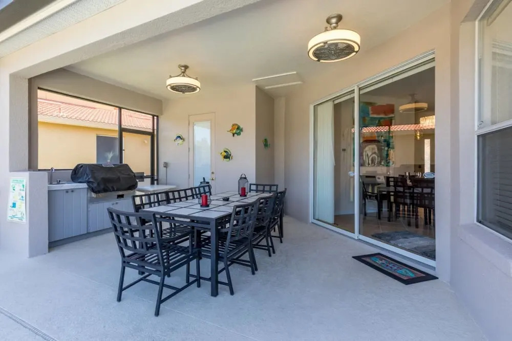 Extended Sunny Pool Deck with Pool and Spa and Lake View in Gated Solterra Resort