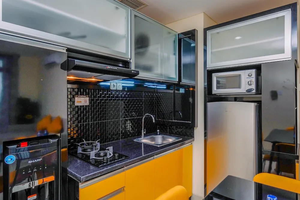 Homey and Fully Furnished 1BR Apartment at Pejaten Park Residence By Travelio