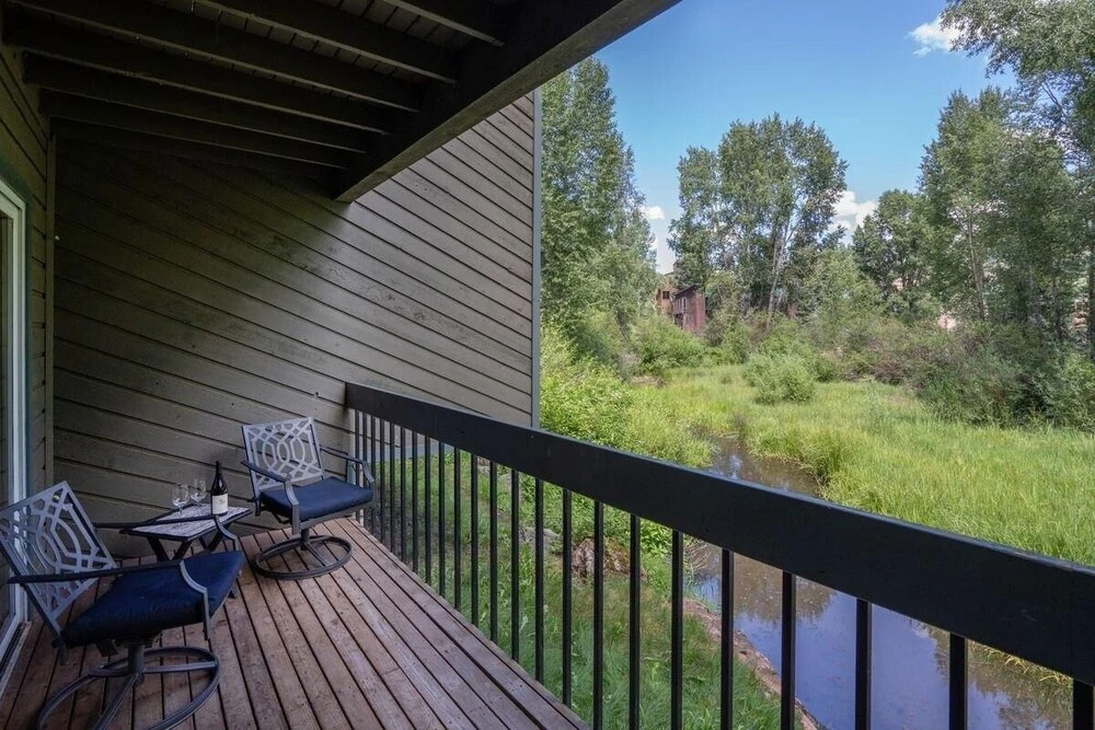 Riverside Dream! Quiet Spot W Deck, 5 Min Walk To Gondola & Main St. 2 Bedroom Condo by RedAwning