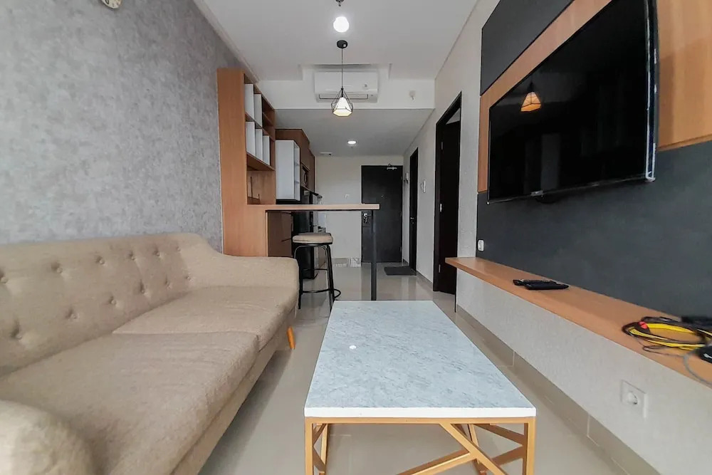 Elegant and Spacious 1BR at Patraland Amarta Apartment By Travelio
