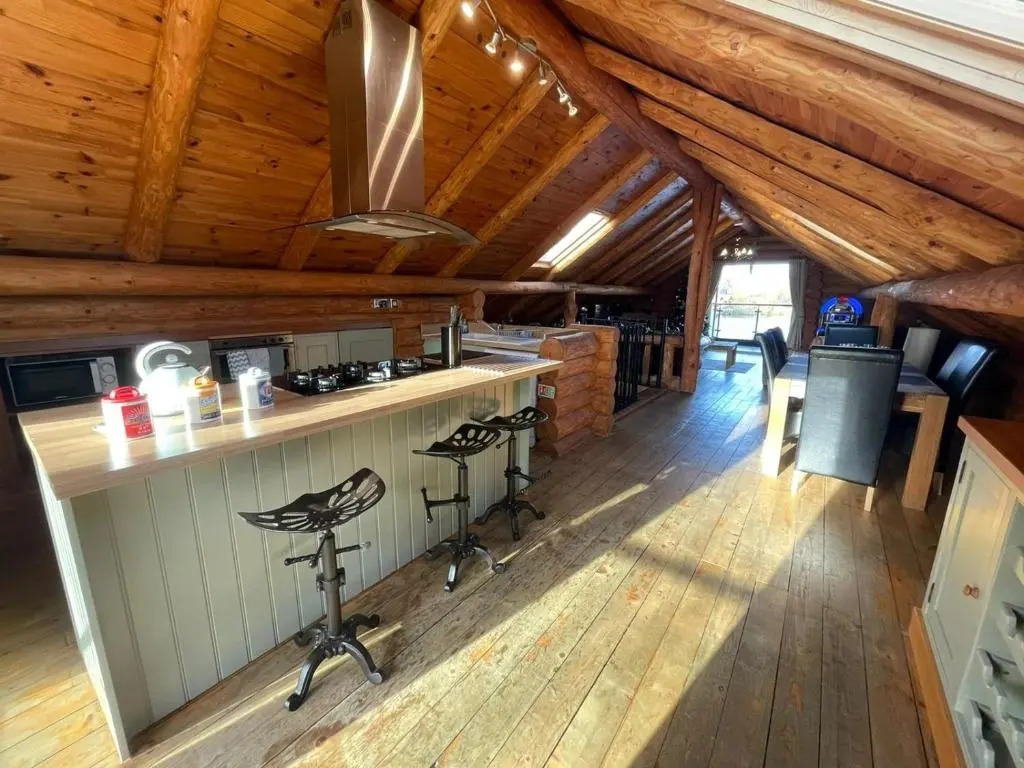 Woodpecker Log Cabin with hot tub, pizza oven bbq entertainment area, lakeside with private fishing peg situated at Tattershall Lakes