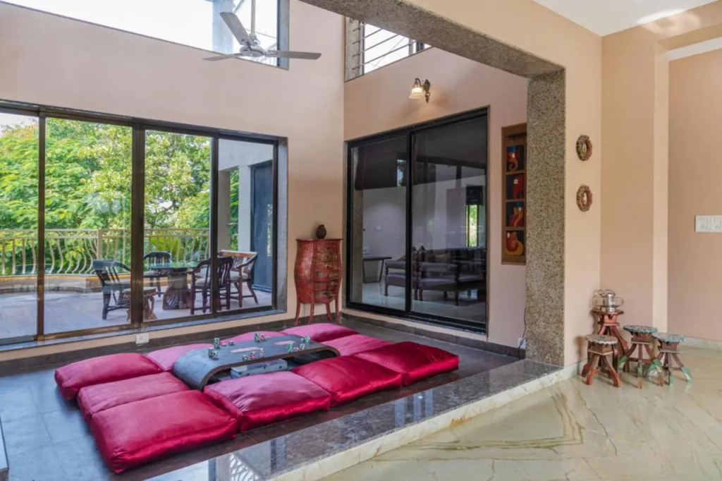 SaffronStays Aura - 4BR luxury pool villa with gym, BBQ deck, lawns & indoor games near Kihim Beach
