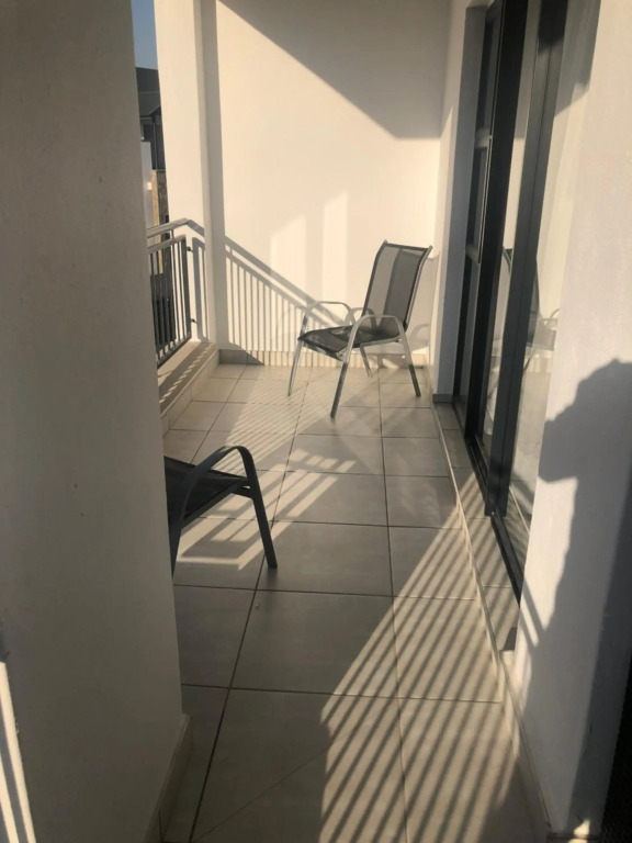 A Coastal/island experience at a Large 2 bed apartment at a Crystal Lagoon Estate