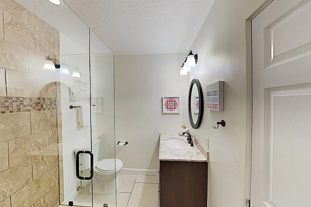 Updated W/ Gated Pool & Screened-in Porch 4 Bedroom Home