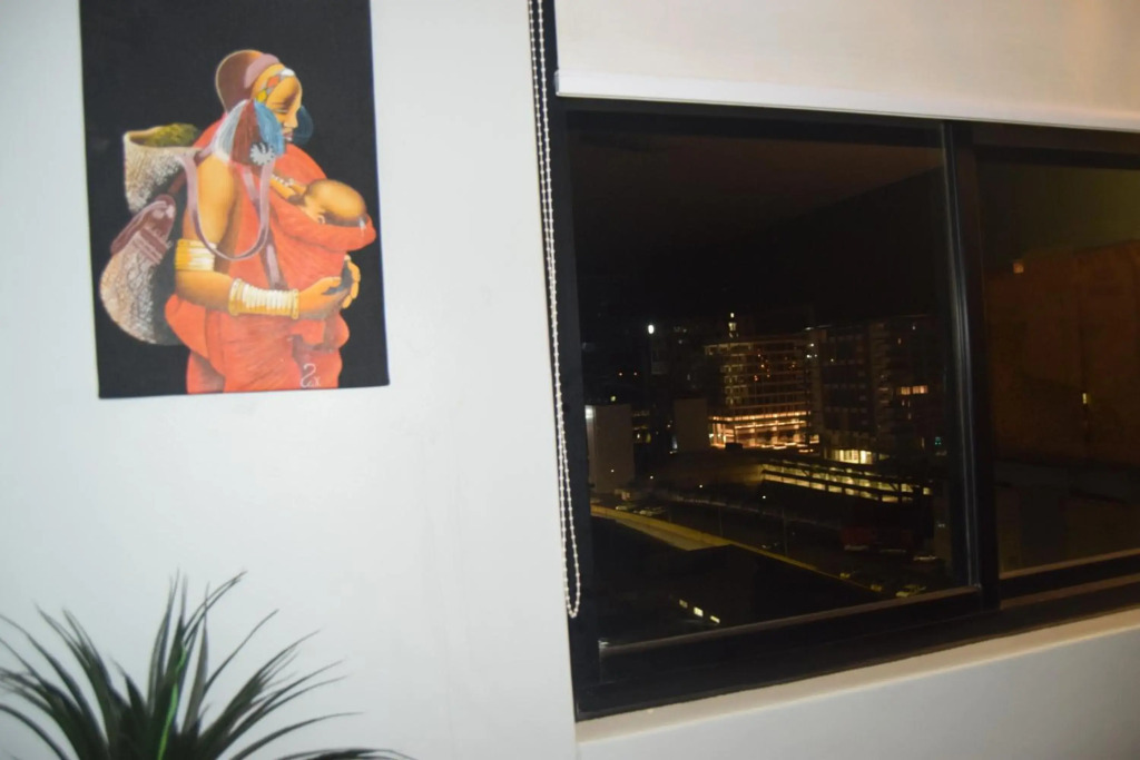 Highrise Windhoek apartment with skyline view, pool and gym