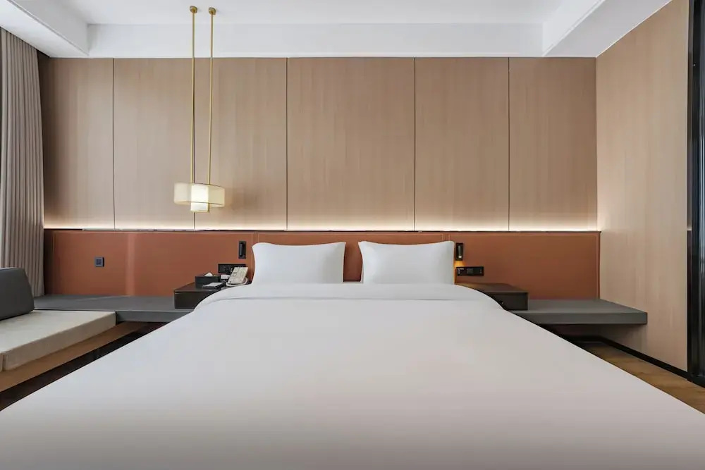 Wanzai Yijia La Maison Hotel