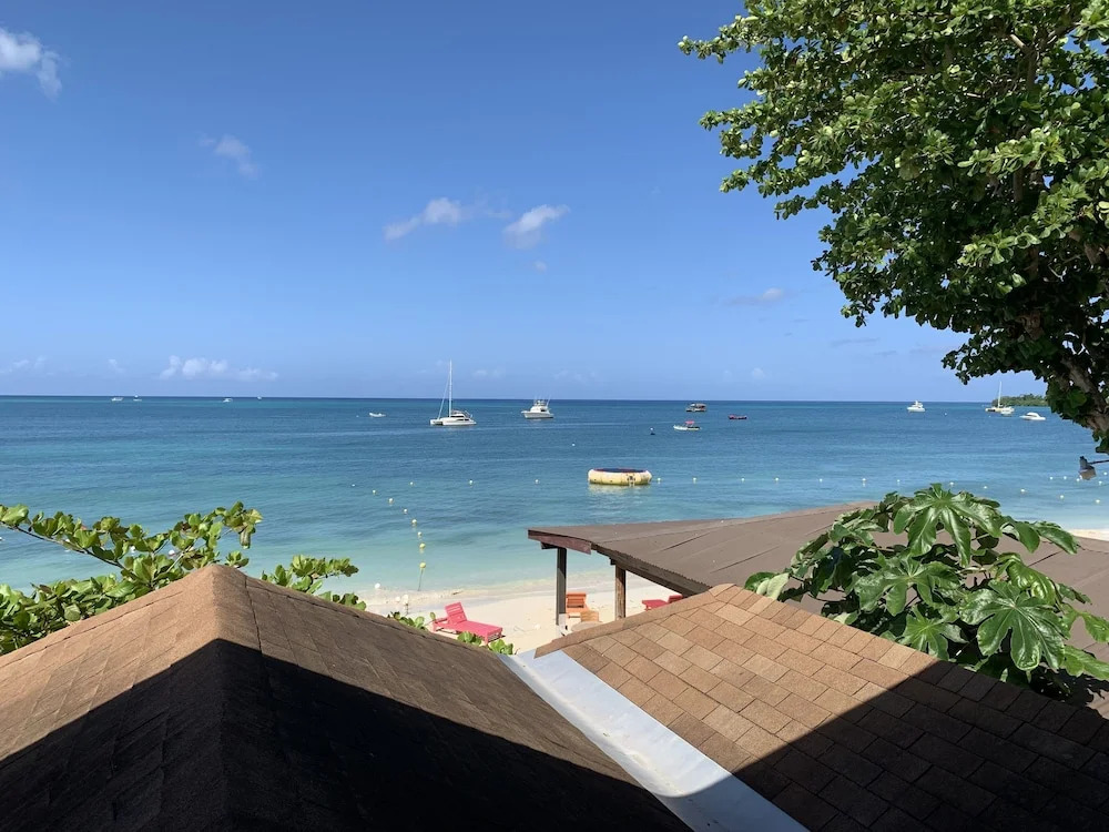 King Suite at Oceanview Resort in Jamaica - Enjoy 7 Miles Of White Sand Beach! 1 Bedroom Villa by RedAwning