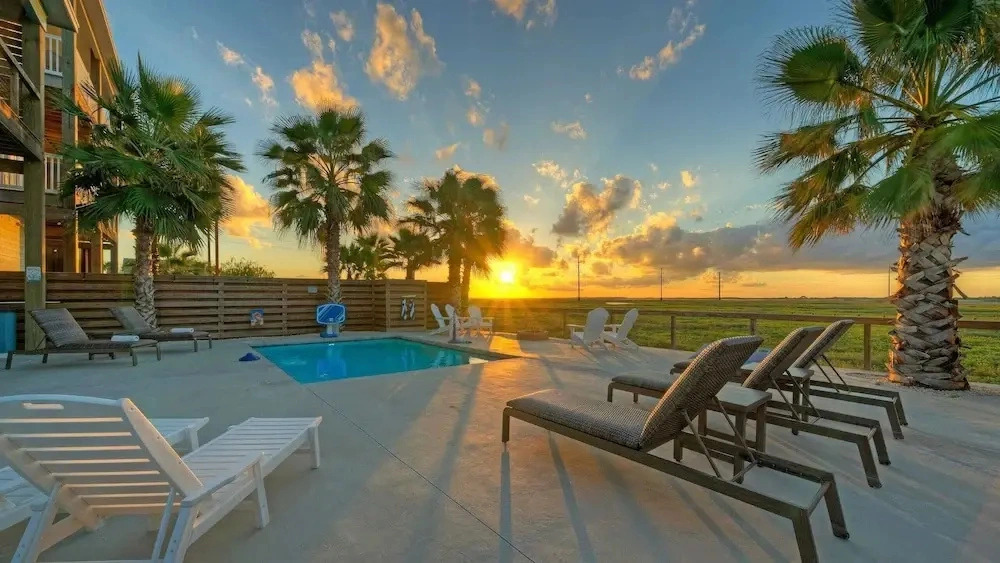 Bayfront Home w/ Pool, Game Room + Walk to Beach & Golf Cart Access Pelicans Perch by Avantstay