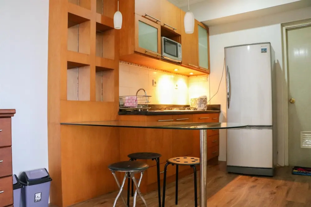 Cozy Living and Modern 2BR Puri Garden Apartment By Travelio