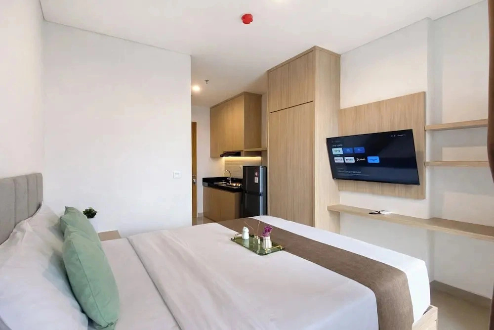 Homey Wooden Touch Studio At Apartment Ciputra World 2