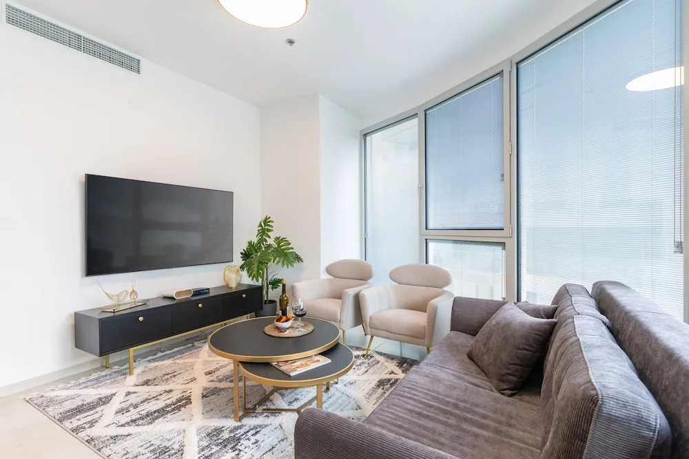 MAMAD - Sunlit Urban Escape with Balcony by Sea N Rent