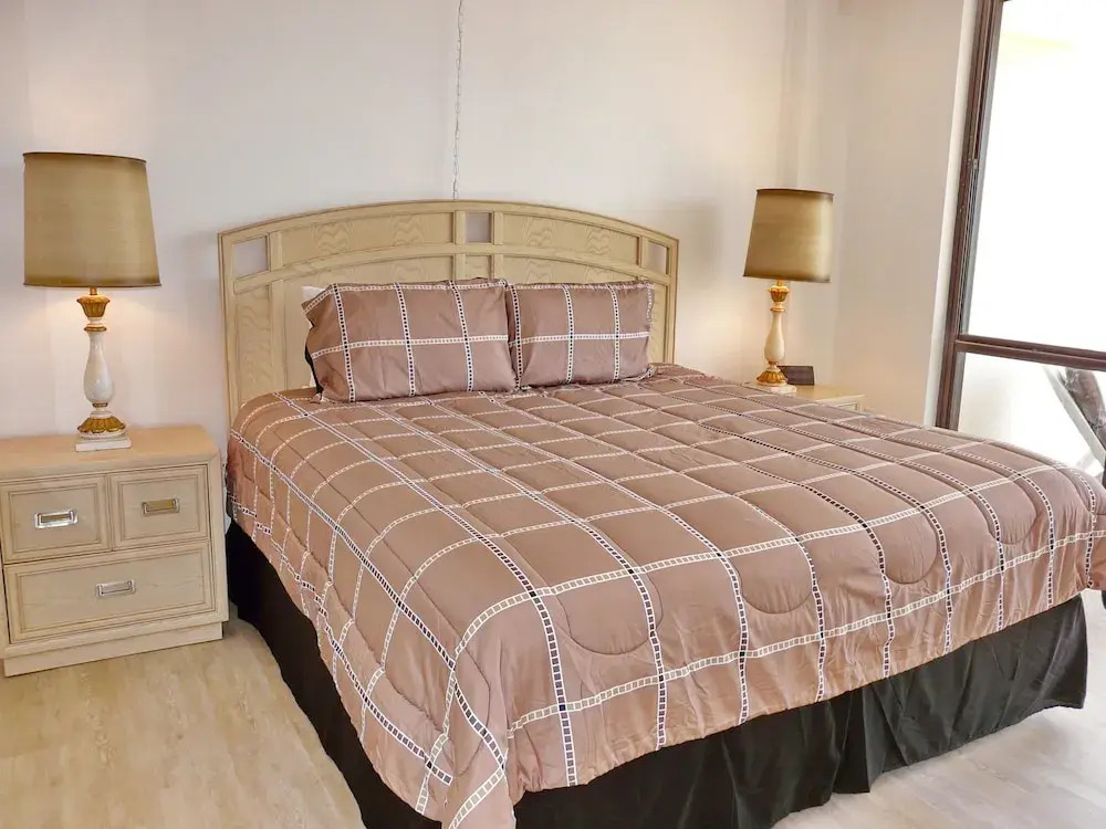 Inviting Beachfront Condo With Large Balcony and Pool
