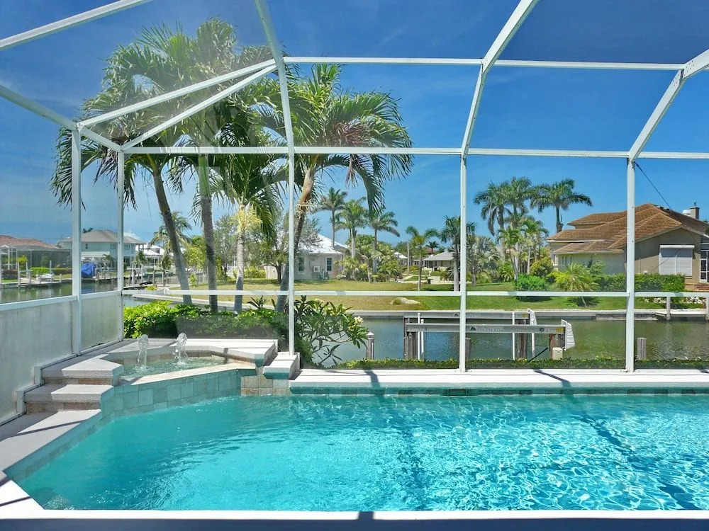 Relaxing Waterfront Home With Pool and Steps to Beach