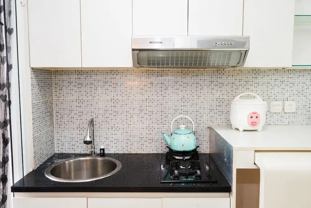 Homey 1BR with City View at Green Pramuka Apartment By Travelio