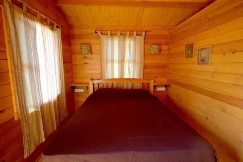 Pele's Windsong Wood Cottage on the beach