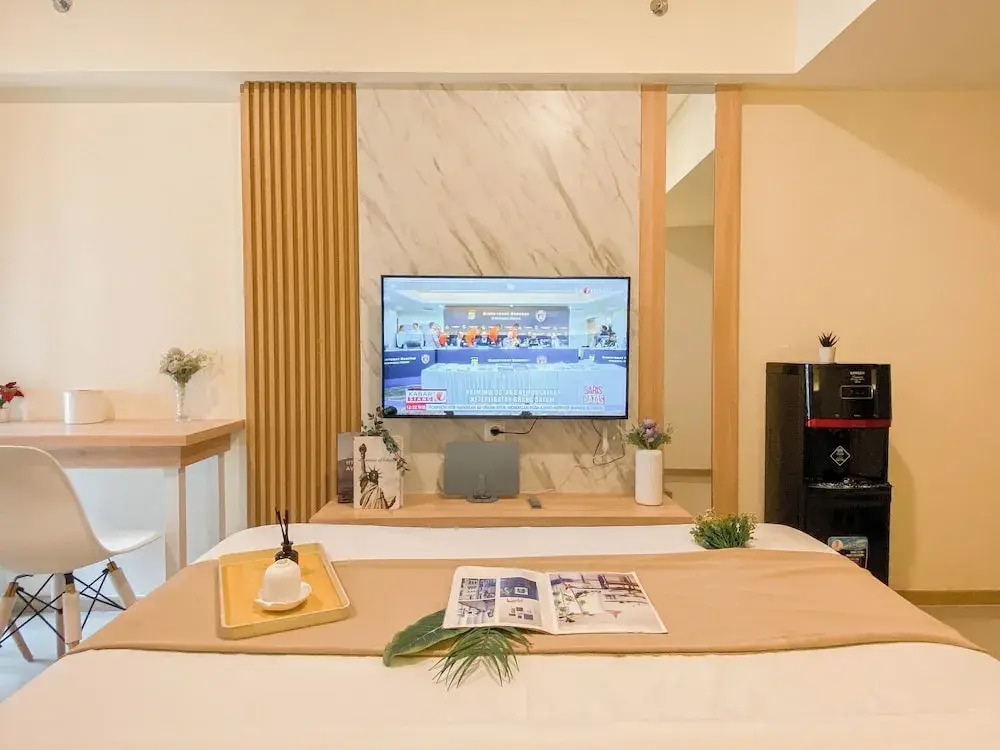 Warm Minimalist Studio Apartment Near Paramadina University At Meikarta