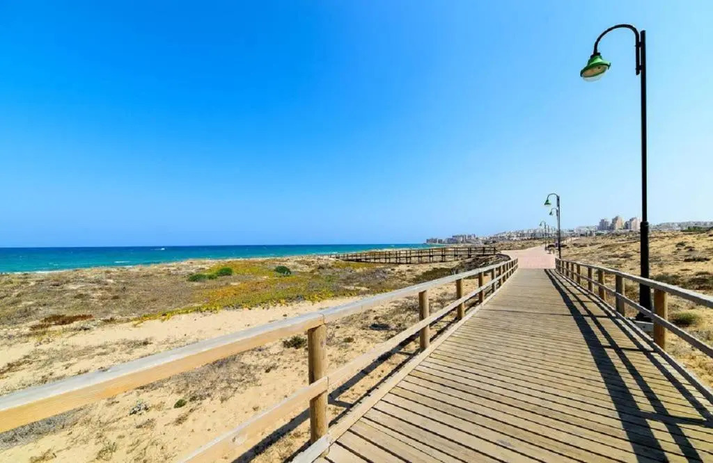 Apartment with pool, sea views & balcony less than 10min walk to La Mata Beach!