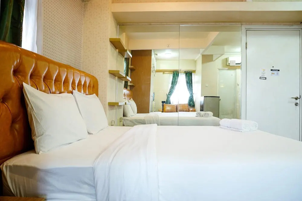Furnished Studio with Comfortable Design Green Pramuka Apartment